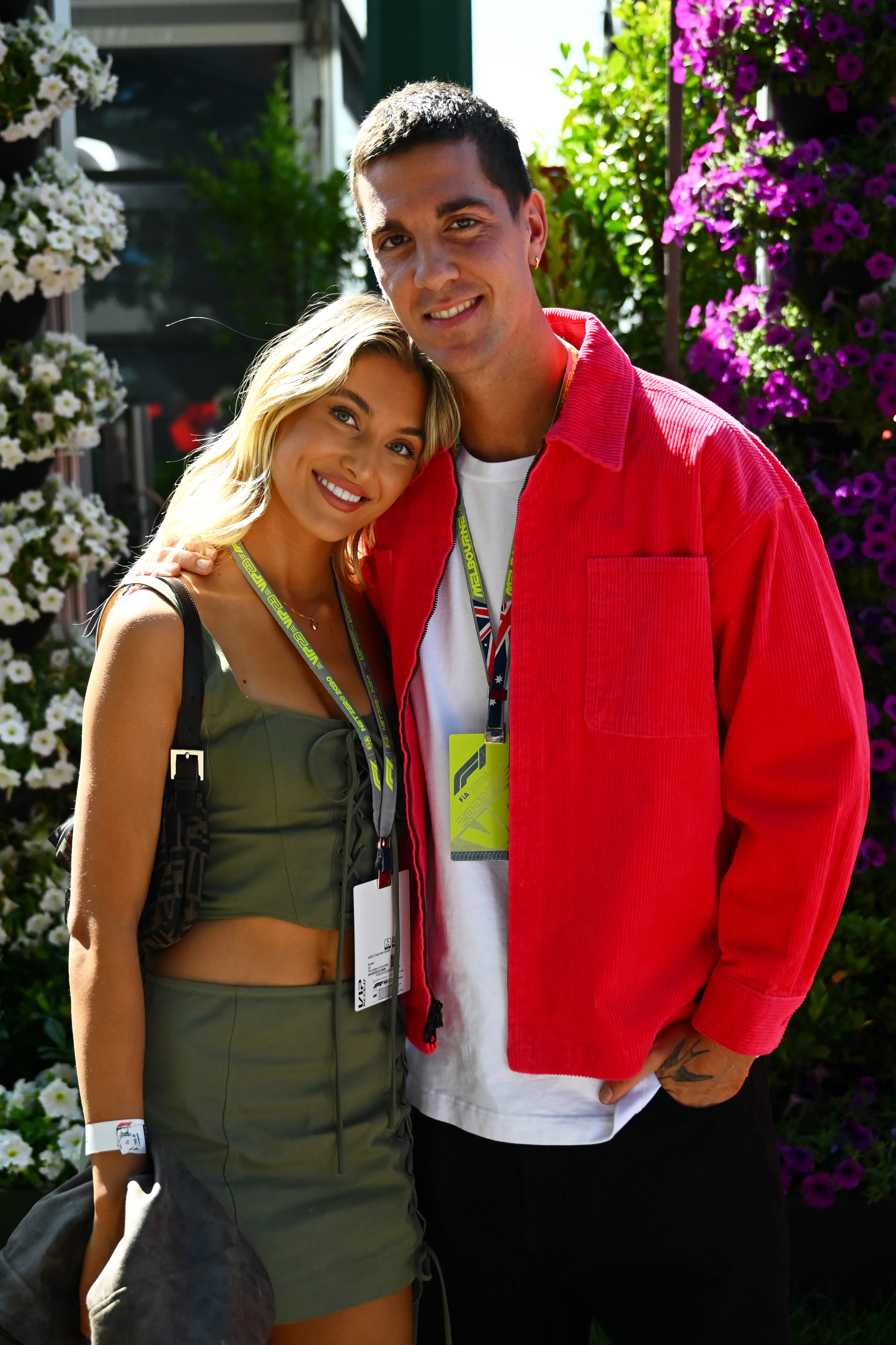 MELBOURNE, AUSTRALIA - APRIL 02: Thanasi Kokkinakis and Hannah Dal Sasso pose for a photo in the Paddock prior to the F1 Grand Prix of Australia at Albert Park Grand Prix Circuit on April 02, 2023 in Melbourne, Australia. (Photo by Clive Mason - Formula 1/Formula 1 via Getty Images)