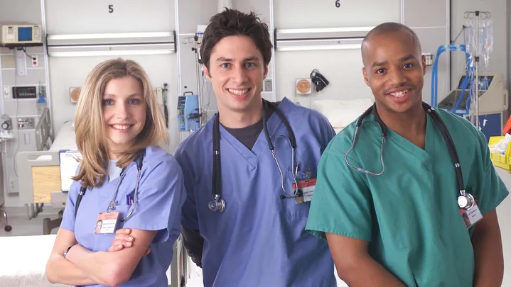 393352 06: (L to R) Actors Sarah Chalke, Zach Braff, and Donald Faison poses for a publicity photo for the television show "Scrubs." (Photo Courtesy of NBC/Getty Images)