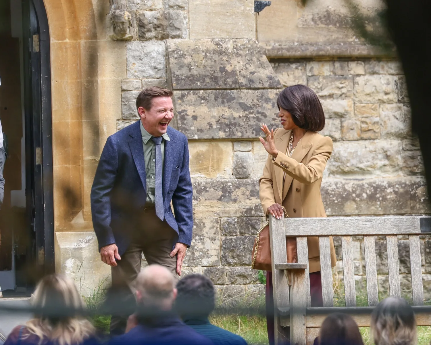 jeremy Renner and Kerry Washington laugh on the set of Knives Out 3