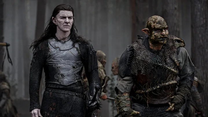 Sam Hazeldine as "Adar" (left)