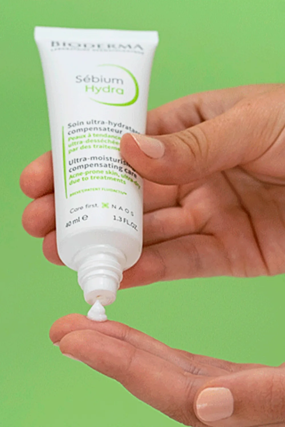 bioderma sebium moisturiser on green background.