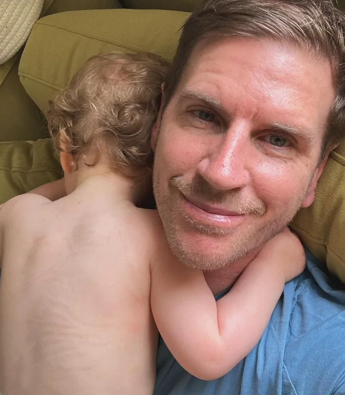 Sam Mac with his first daughter Margot.