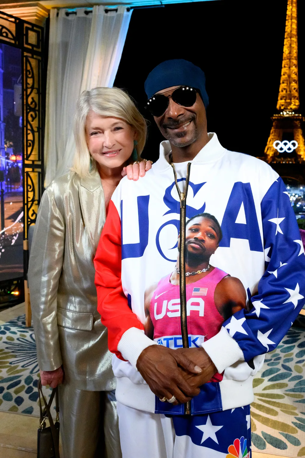 Martha Stewart and Snoop Dogg standing in front of the Eiffel Tower. 