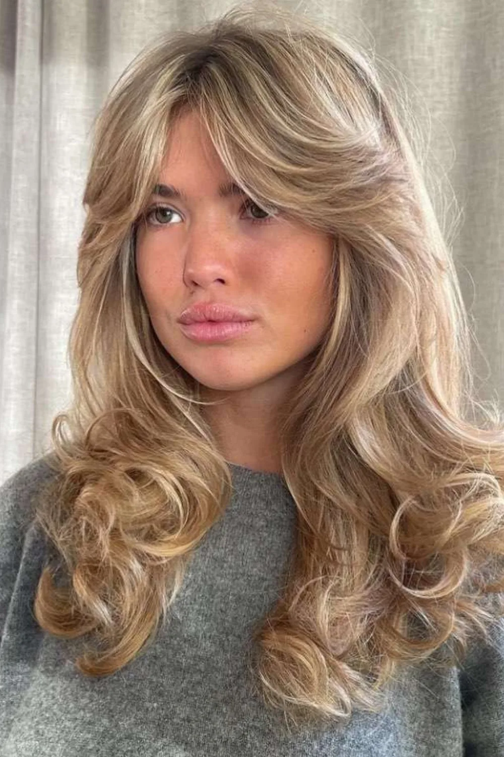 Matilda Djerf wearing a grey jumper. 