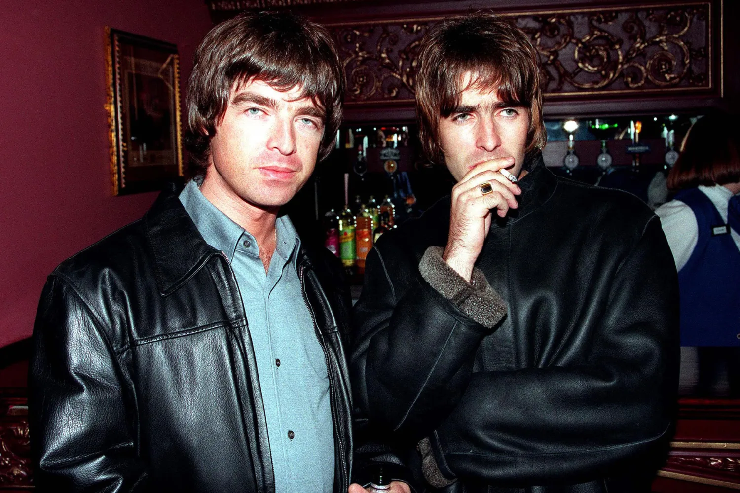 Noel and Liam Gallagher of Oasis wearing leather jackets.