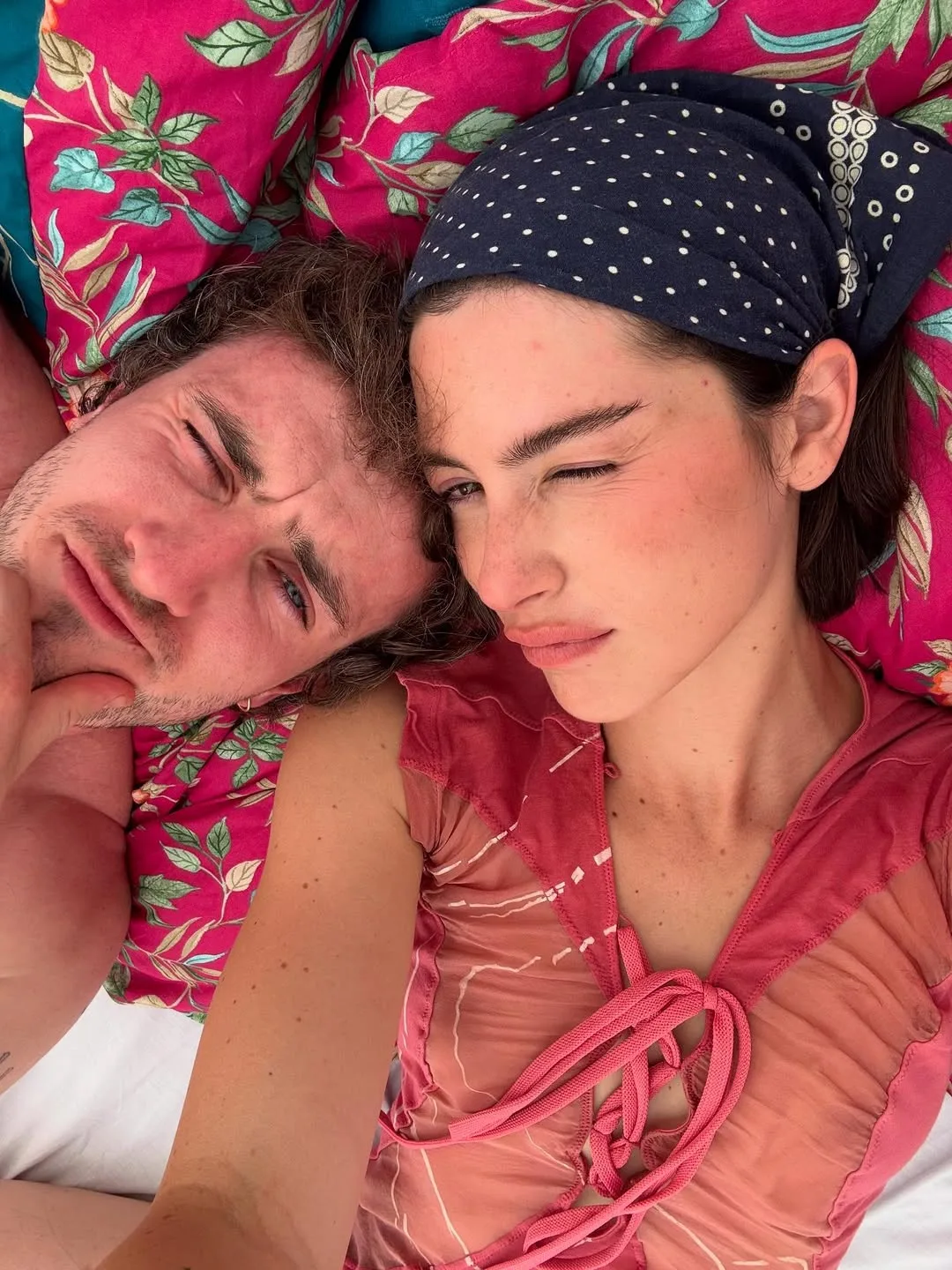 paul mescal gracie abrams take a selfie laying on the ground at glastonbury 2025