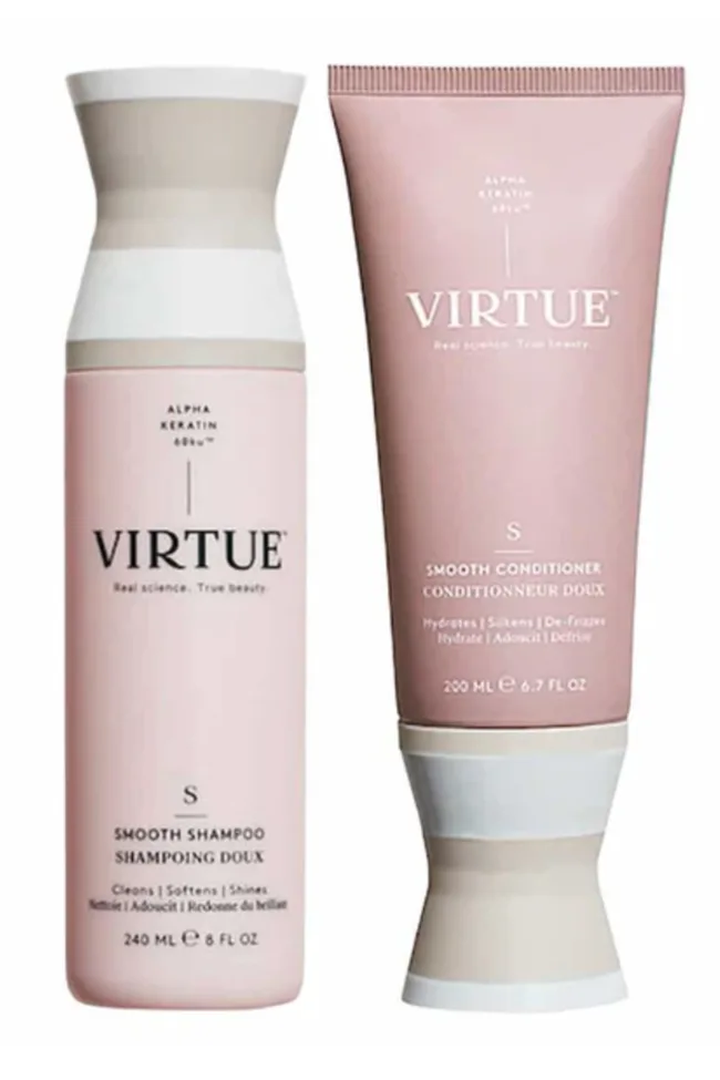 Two pink Virtue Smooth Shampoo and Conditioner bottles.