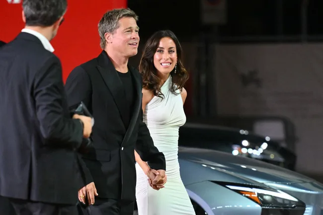 Ines de Ramon and Brad Pitt