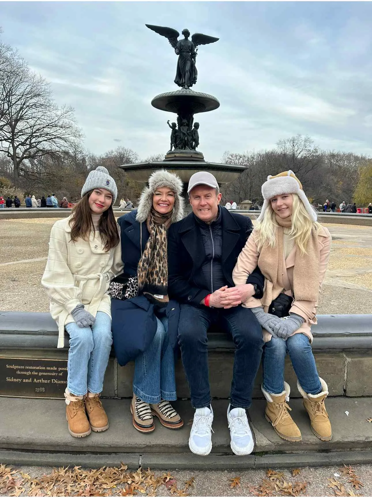 Jessica Rowe and Peter Overton sit together with their daughters Gisele and Allegra.
