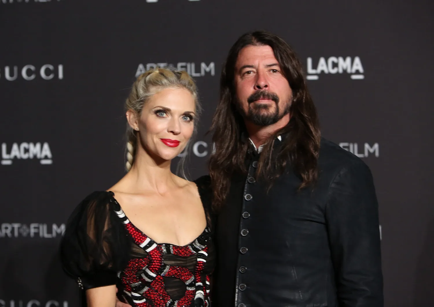 Dave Grohl posing with wife Jordyn Blum