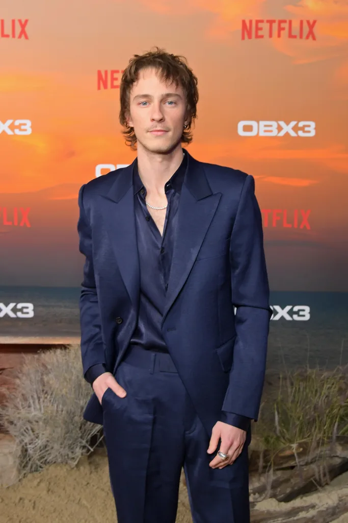 LOS ANGELES, CALIFORNIA - FEBRUARY 16: Drew Starkey attends the Netflix Premiere of Outer Banks Season 3 at Regency Village Theatre on February 16, 2023 in Los Angeles, California. 