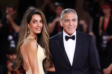 VENICE, ITALY - SEPTEMBER 01: Amal Clooney and George Clooney attend the "Wolfs" red carpet during the 81st Venice International Film Festival on September 01, 2024 in Venice, Italy. (Photo by Maria Moratti/Getty Images)