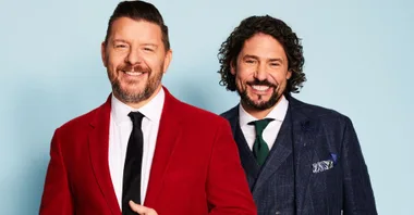 Manu Feildel and Colin Fassnidge smile in suits