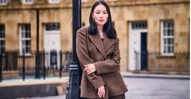 Yerin Ha stands on the set of Bridgerton