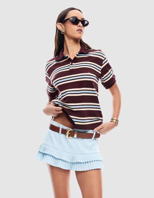 Model wearing lioness striped polo top