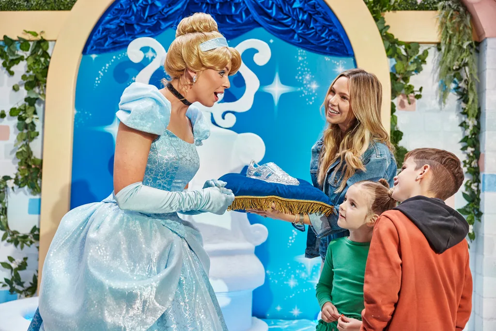 Cinderella being presented the crystal football shoe