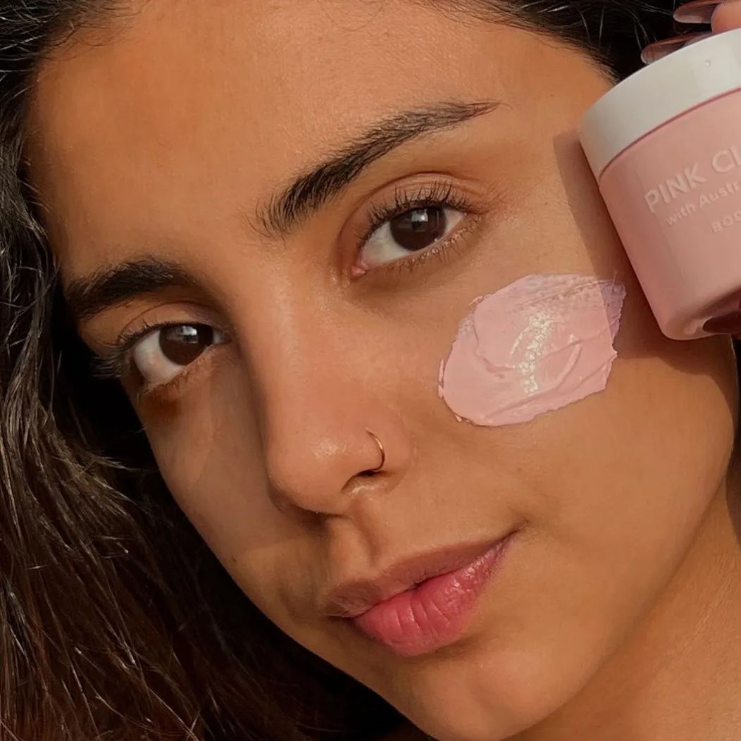 A shopper with the pink clay mask