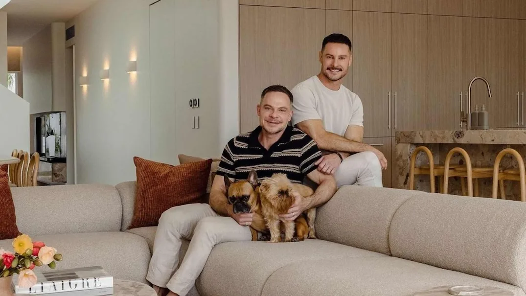 Darren Palmer at home with his husband Olivier Duvillard and their two dogs.