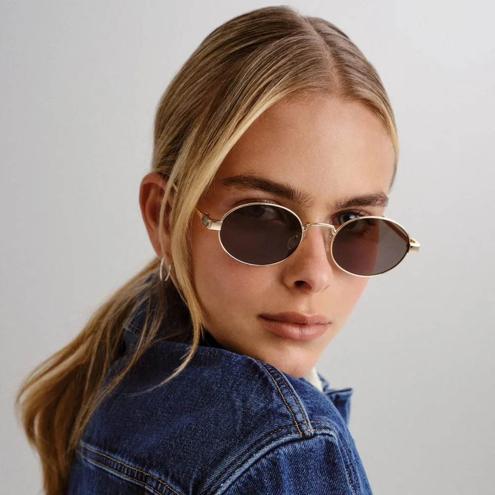 model wearing lespecs sunglasses