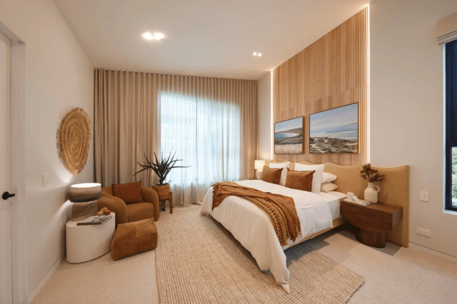 A coastal themed bedroom with wood panel wall. 