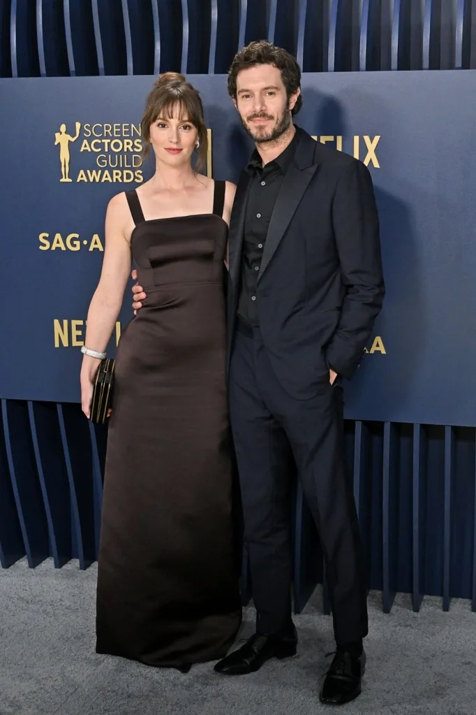 Adam Brody posing with wife Leighton Meester