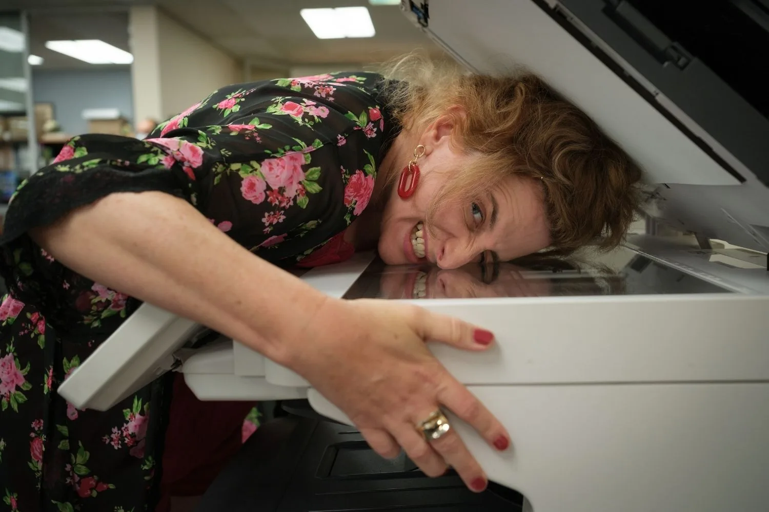 Felicity Ward as Hannah Howard puts her face in a photocopier in a scene from The Office