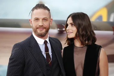 British actor Tom Hardy and his wife Charlotte Riley pose for a photograph upon arrival for the world premiere of "Dunkirk" in London on July 13, 2017.