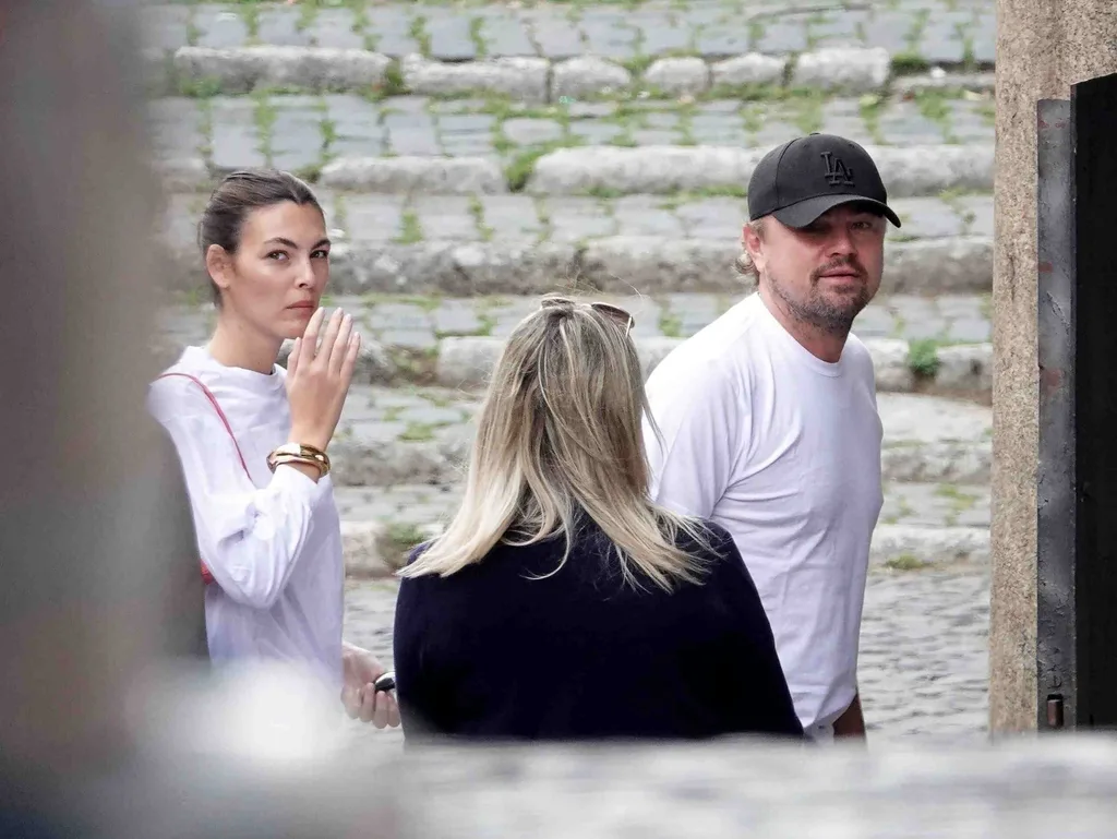 Leonardo DiCaprio with Vittoria Ceretti as they join his parents for a stroll in Rome