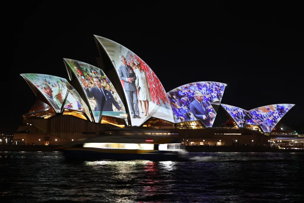 The opera house is lit up with images of King Charles