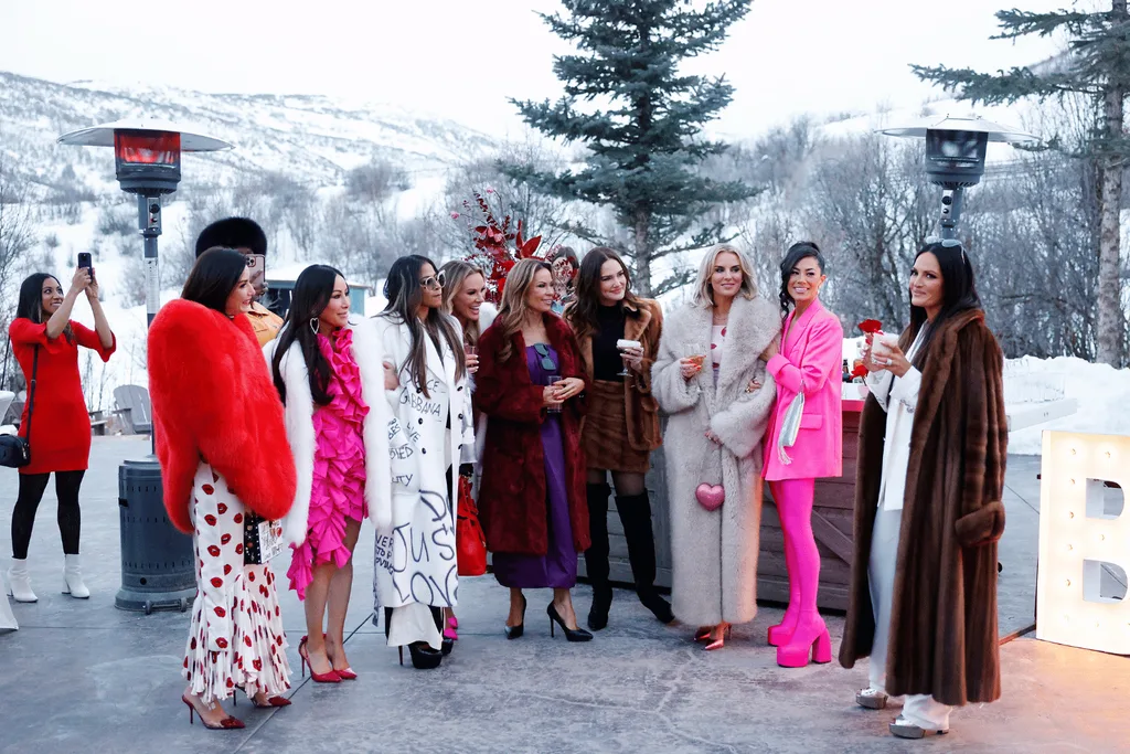 The Reeal Housewives of Salt Lake City standing outside in front of a snowy mountain.