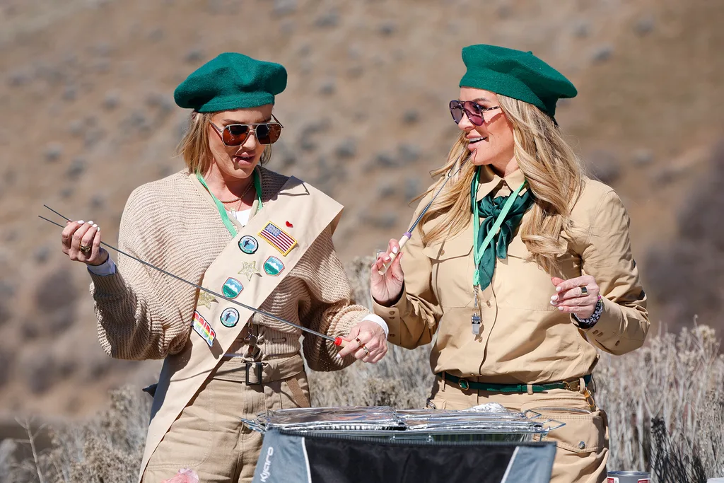 Heather Gay and Whitney Rose from The Real Housewives of Salt Lake City wearing girl scout uniforms.