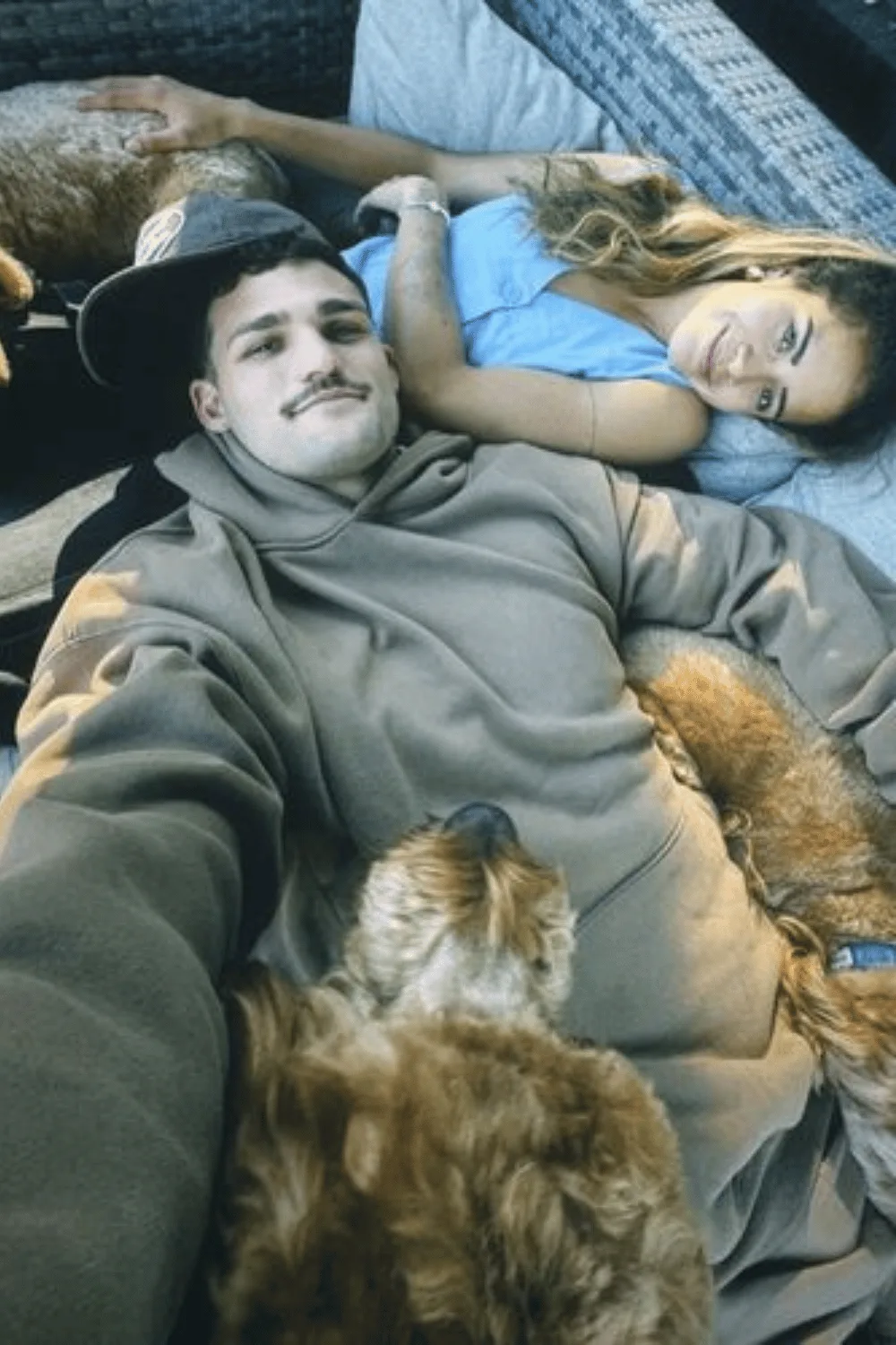 Mary Fowler and Nathan Cleary with their two dogs. 