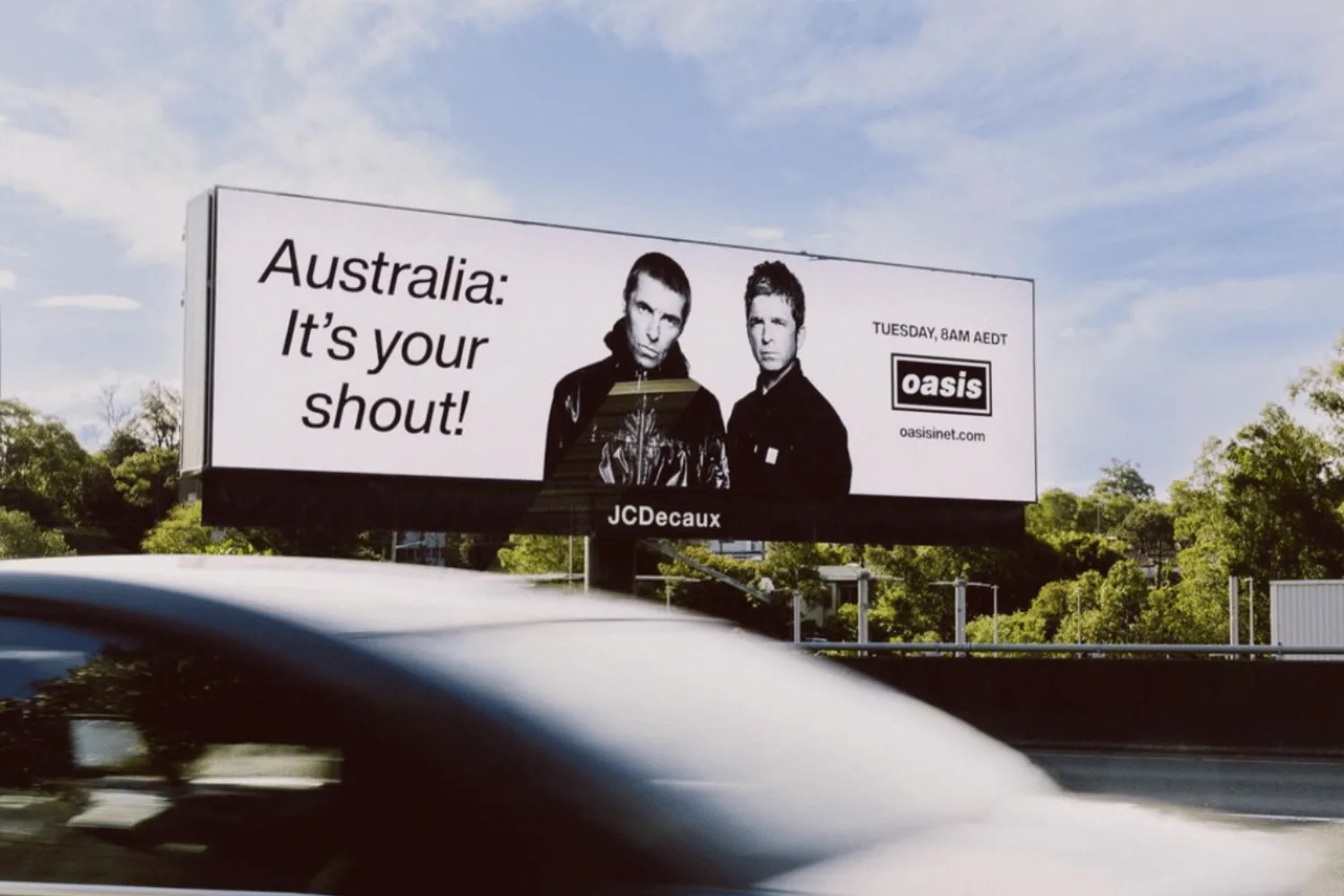 An Oasis promotional billboard with the slogan "Australia: It's your shout!" 