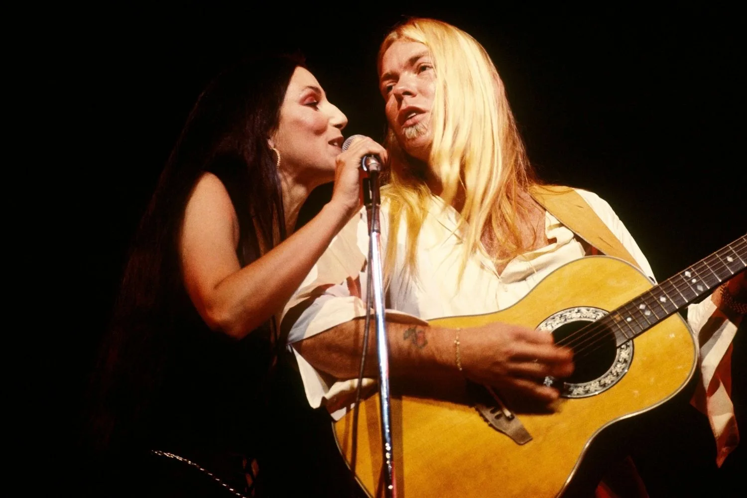 Cher performing with rock star boyfriend Greg Allman in 1977.