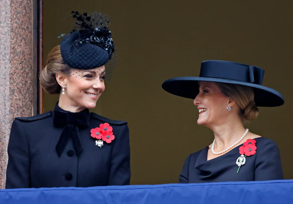 The Princess of Wales and Duchess of Edinburgh share a laugh while watching Prince WIlliam lay a wreath