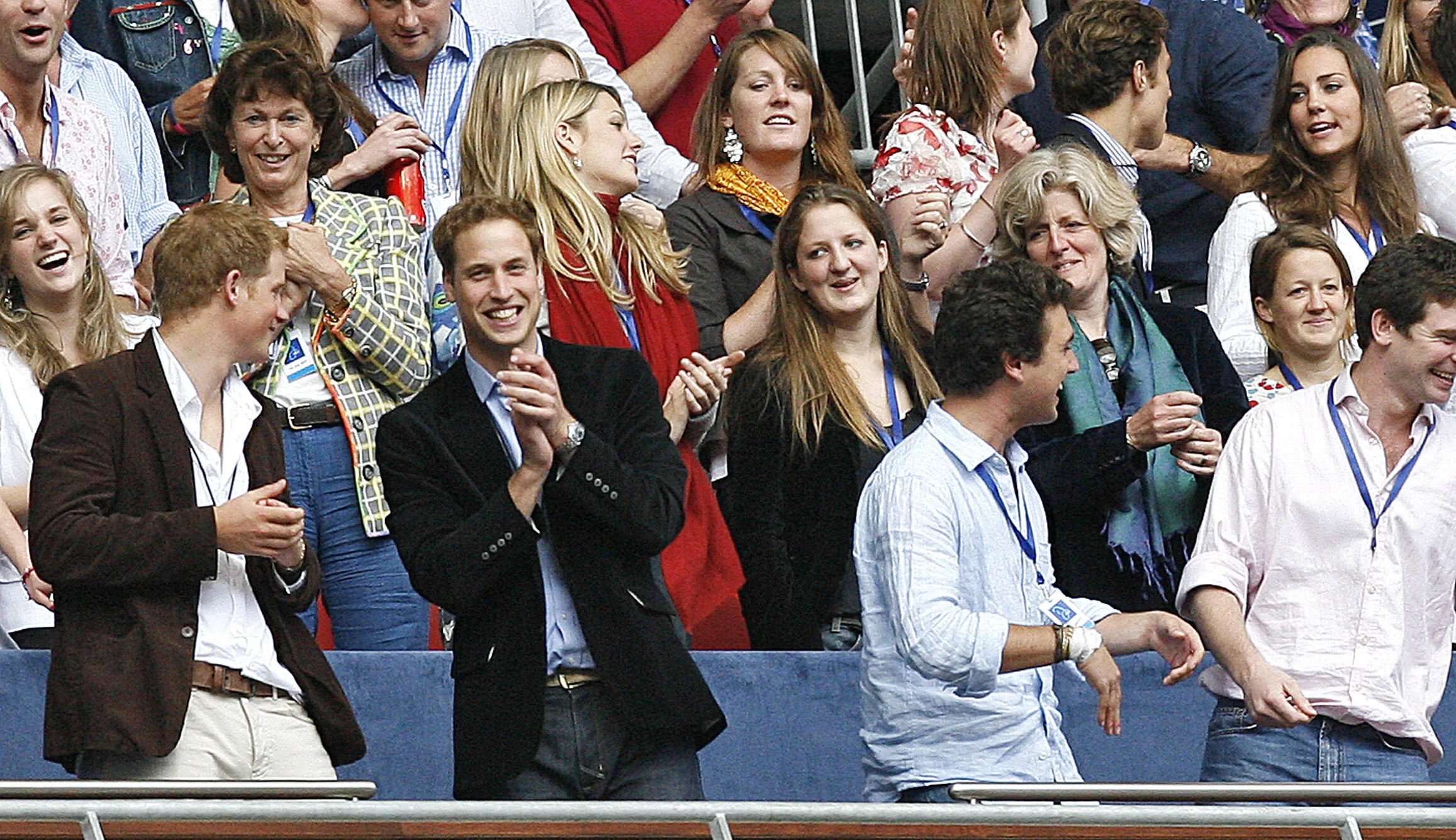 Kate Middleton sits discreetly behind Prince William at the concert for Diana in 2007