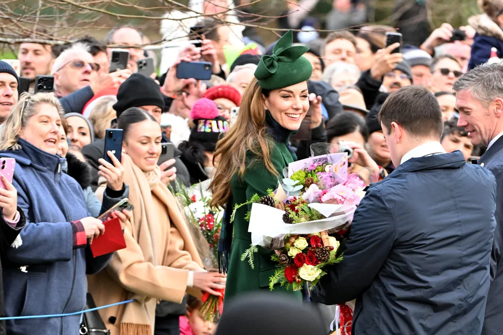 Kate accepting flowers from the public on Christmas day