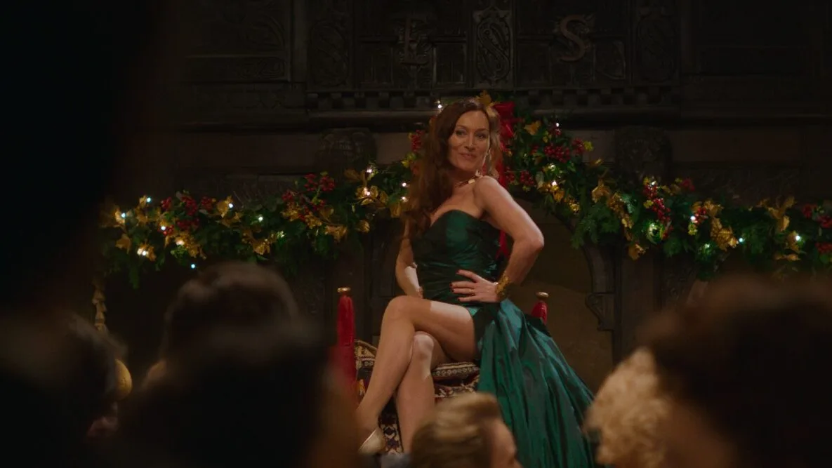Actress Victoria Smurfit wears a green dress in a scene from Rivals