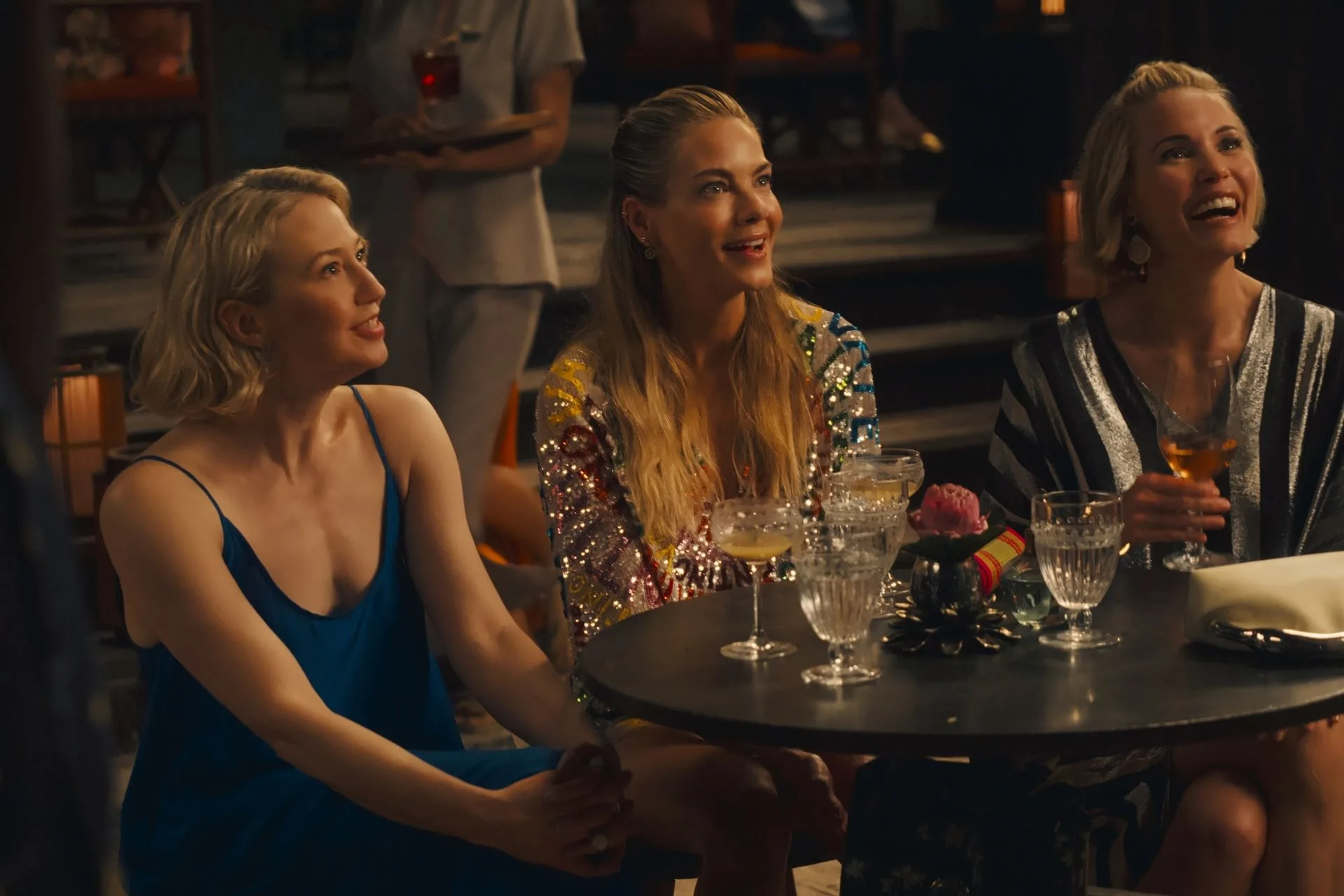 Carrie Coon, Michelle Monaghan and Leslie Bibb appear in character in a scene from The White Lotus Season 3.