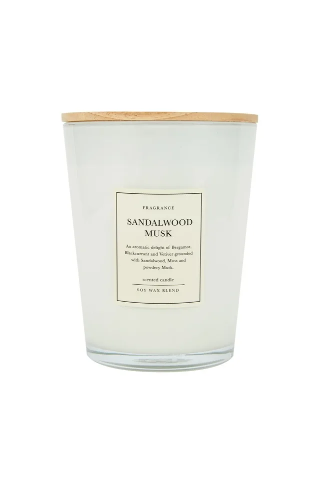 Kmart XL Sandalwood musk candle in a glass cannister with a wooden lid