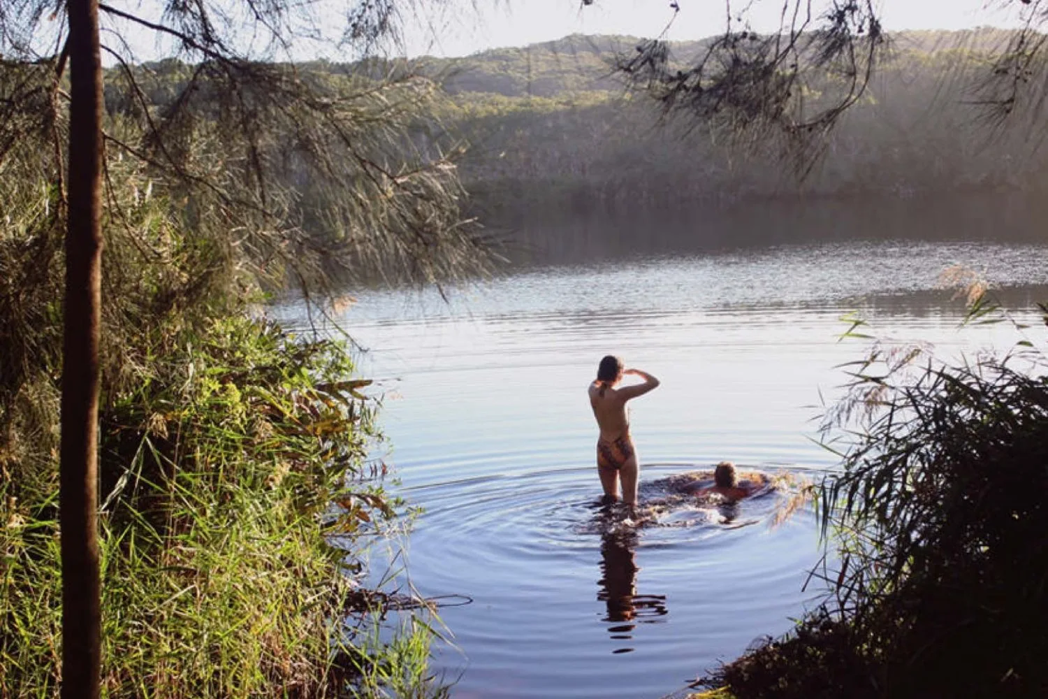 couple bathing in lake Soma retreat