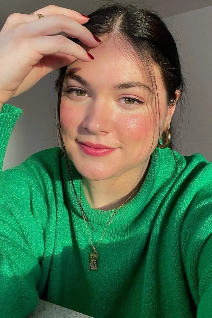 Hope Zuckerbrow in a green jumper