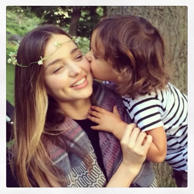 Miranda Kerr is kissed on the cheek by her young son Flynn