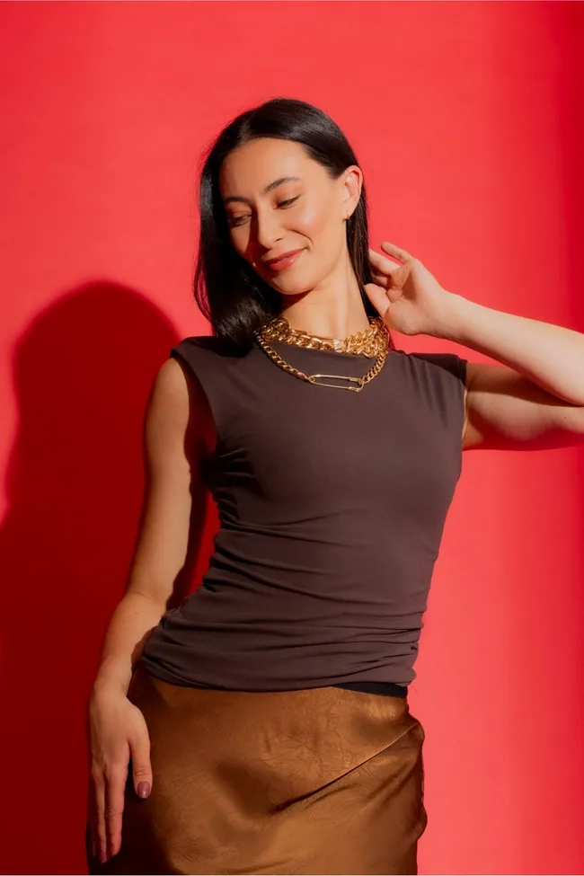 Girl in brown tank top