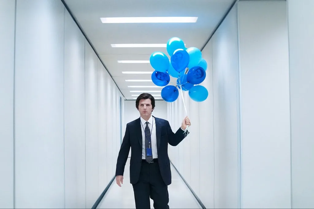 Adam Scott holds a bunch of blue balloons in a scene from Severance