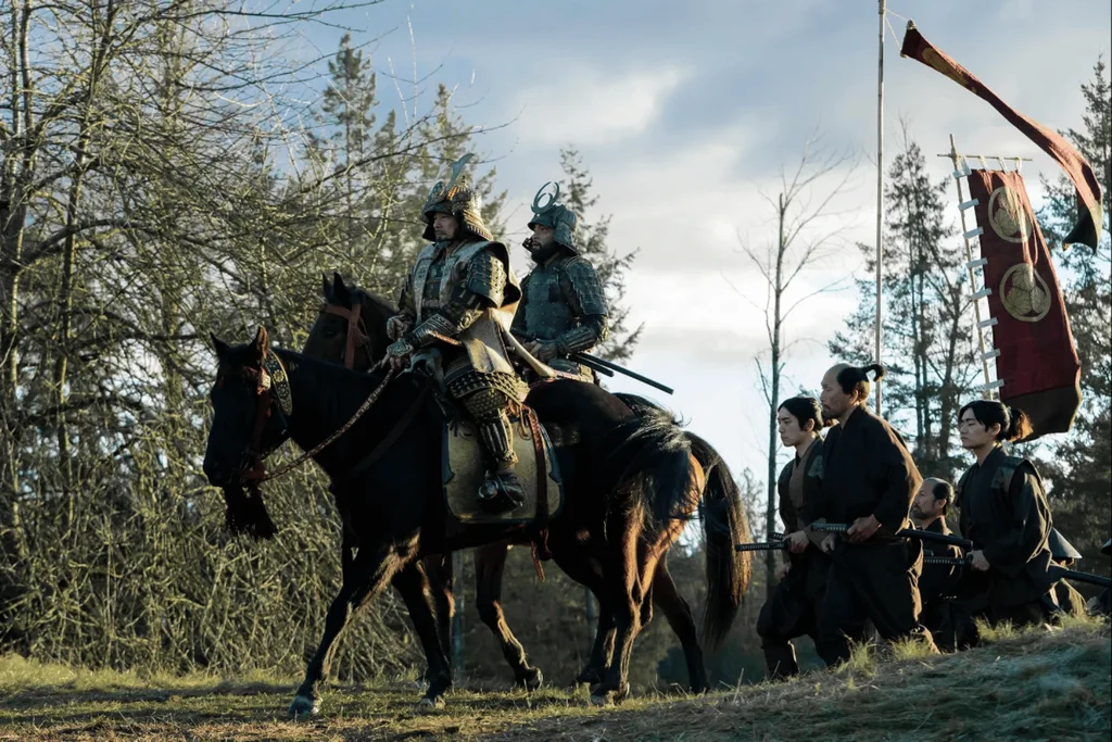 A still from Shogun depicting two soldiers on horseback