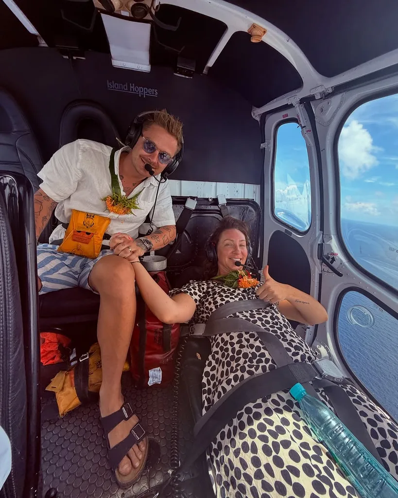 Isabelle Silbury and husband in Fiji helicopter
