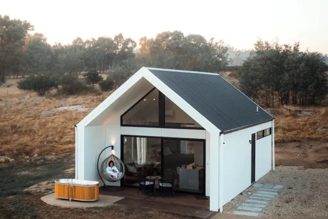 White Cabin Exterior of Vinyard Stay Cottage 1 atGlenbosch Wine Estate