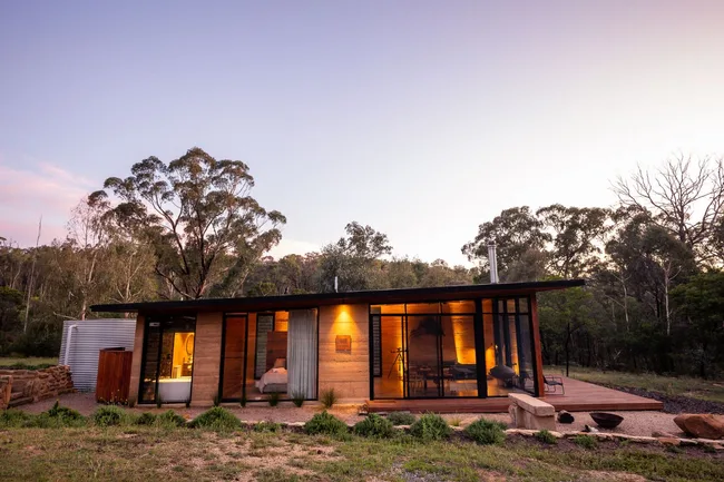 Winyu Cabin exterior with sunset in background