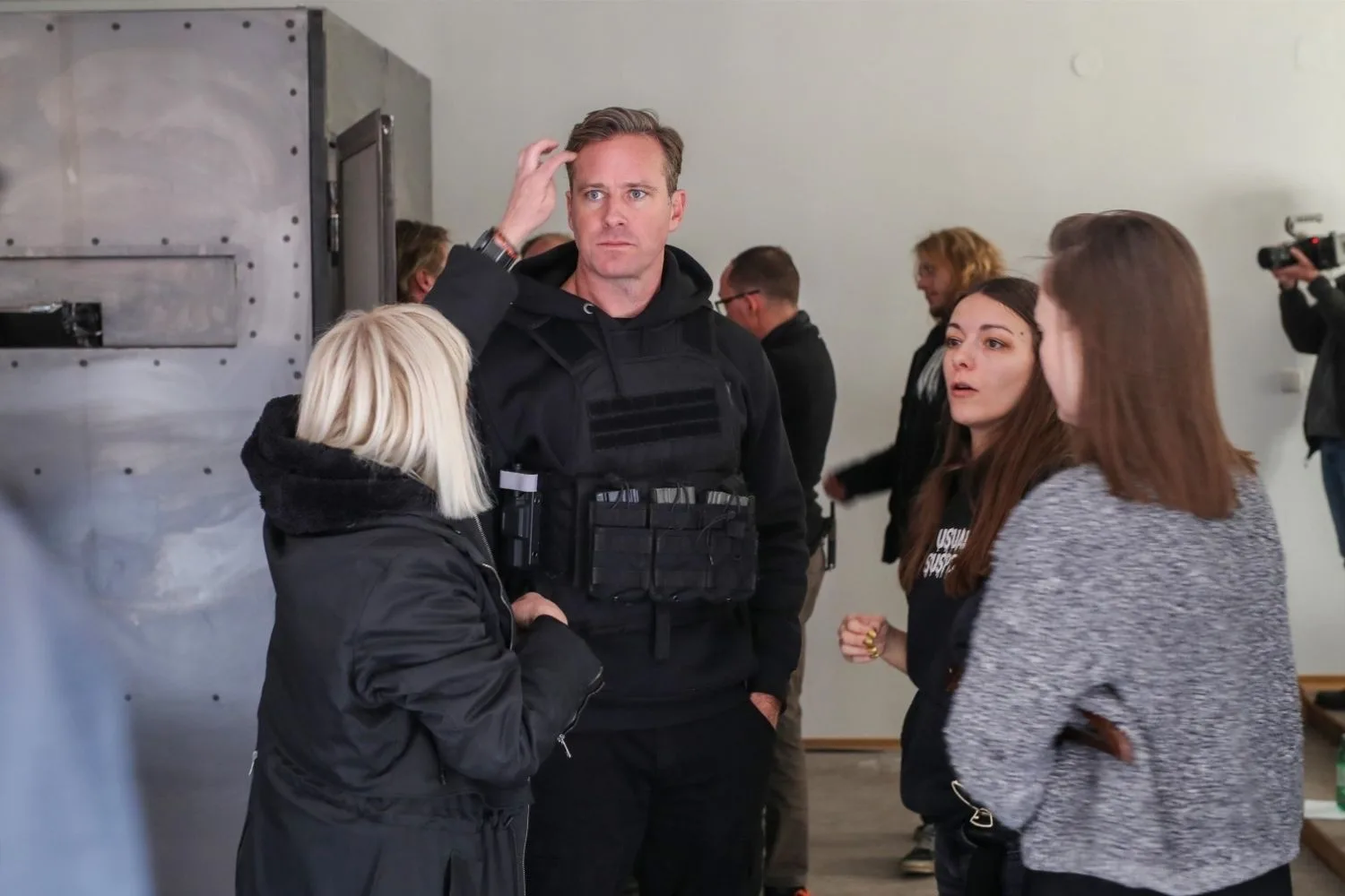 Armie Hammer filming movie wearing flak jacket